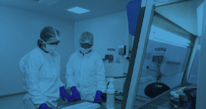 Picture from within Radiofilum's ADC development and manufacturing facility in Deeside, Wales showing two people within an ADC manufacturing suite