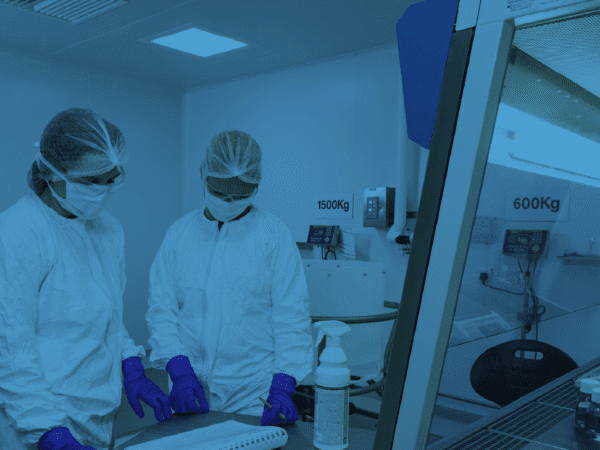Picture from within Radiofilum's ADC development and manufacturing facility in Deeside, Wales showing two people within an ADC manufacturing suite