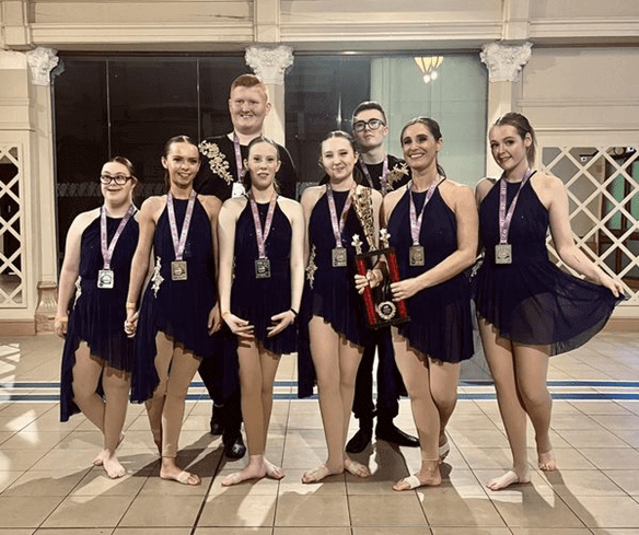 Group photo of the True Colours theatre group after participating at a dance competition in Blackpool