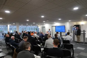Attendees of the ISPE visit at Radiofilum Pharmaceutical Solutions' facility sitting for a presentation